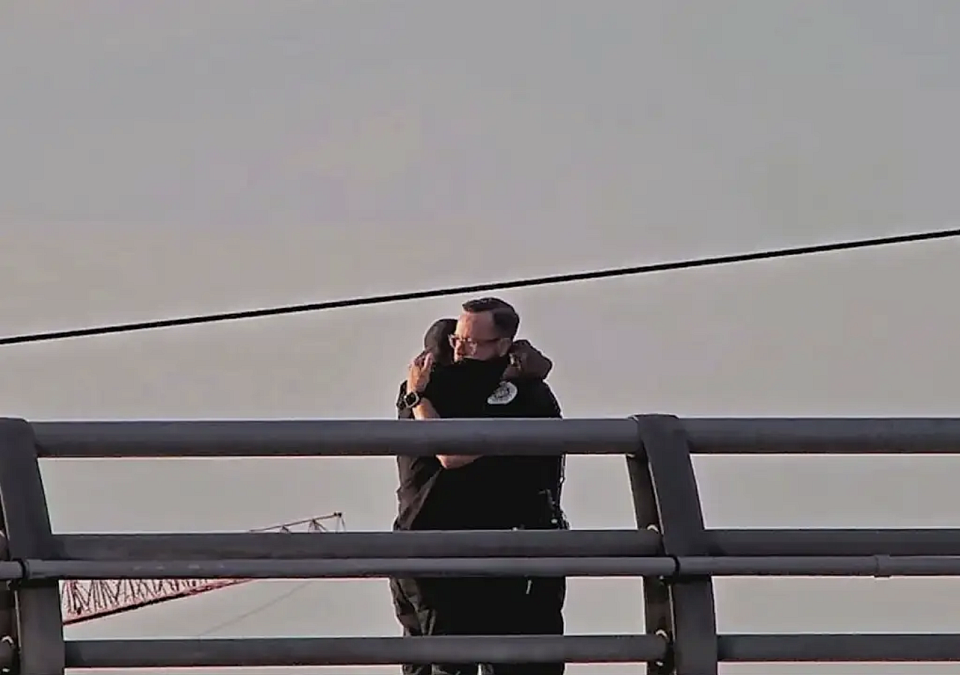 Officer Saves Man on Bridge with Gestures of Gentleness